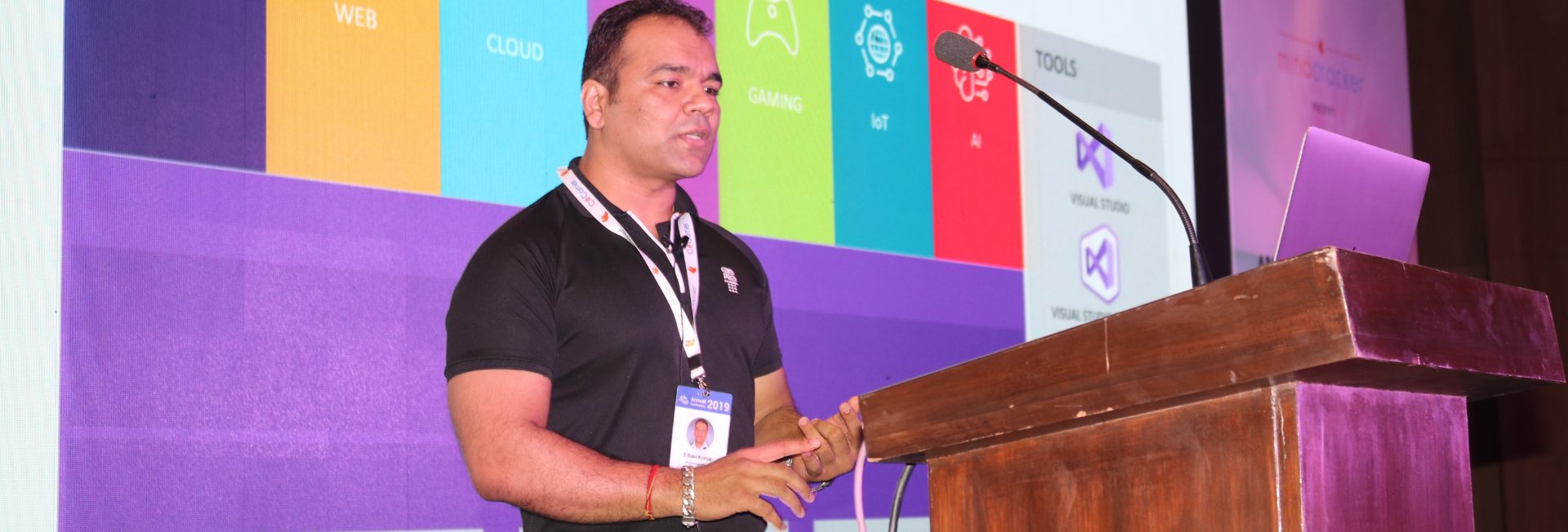 S Ravi Kumar speaking at a conference podium
